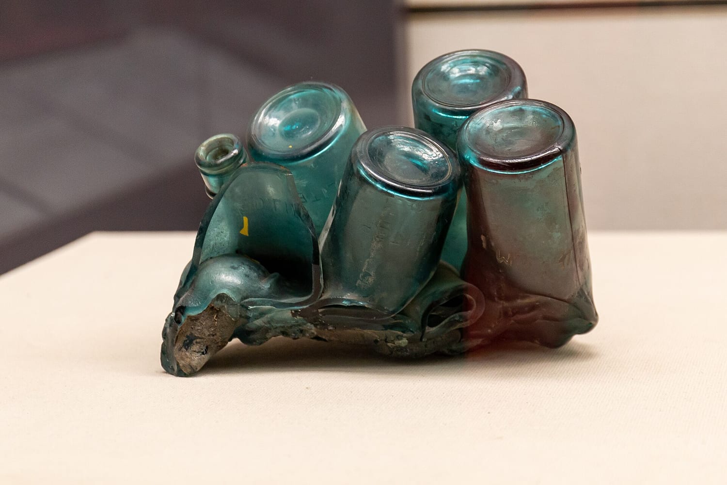 Fused glass pieces on display, showing a range of colors and surface textures