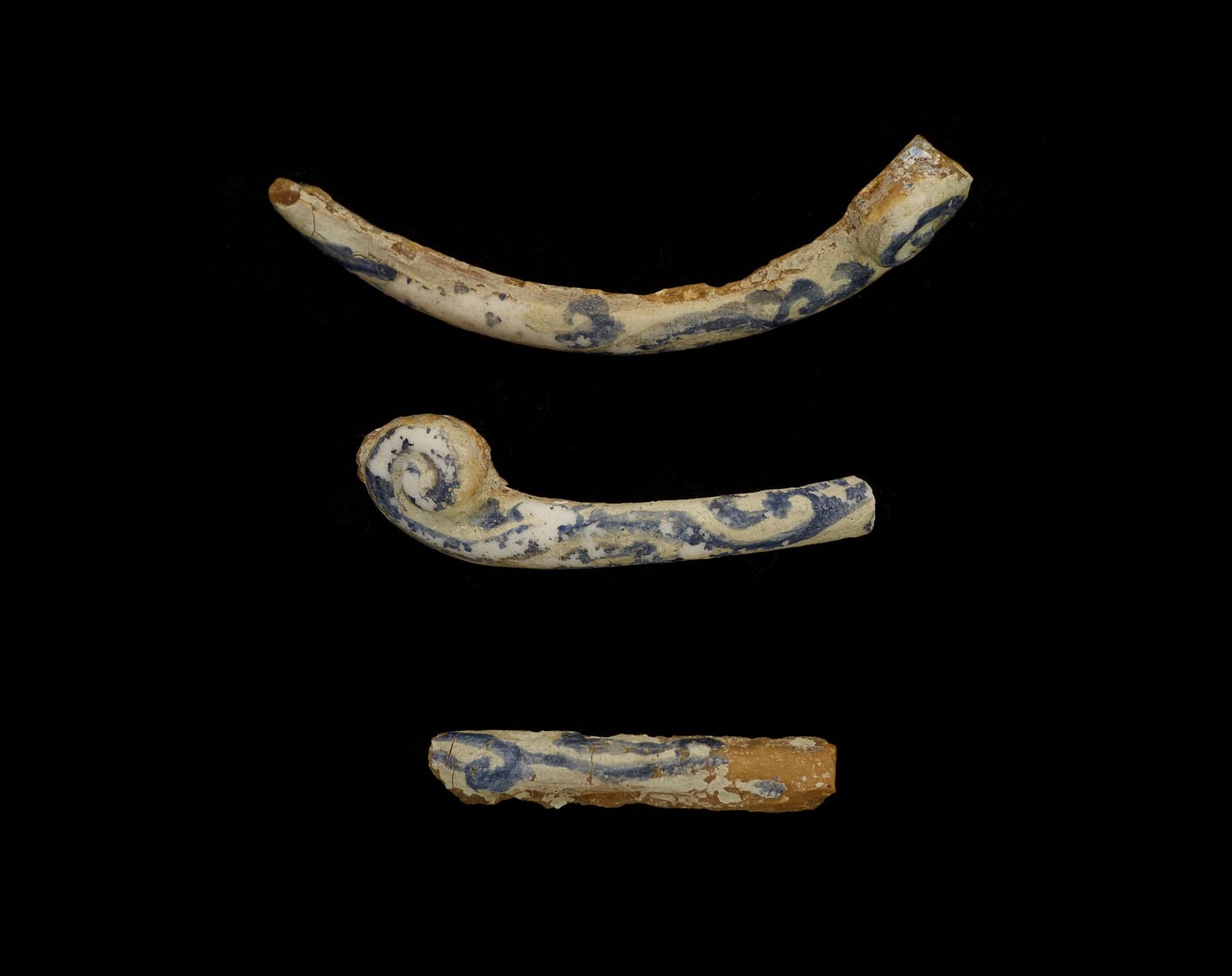 Pieces of crushed and partially fused colored glass frit on a neutral background