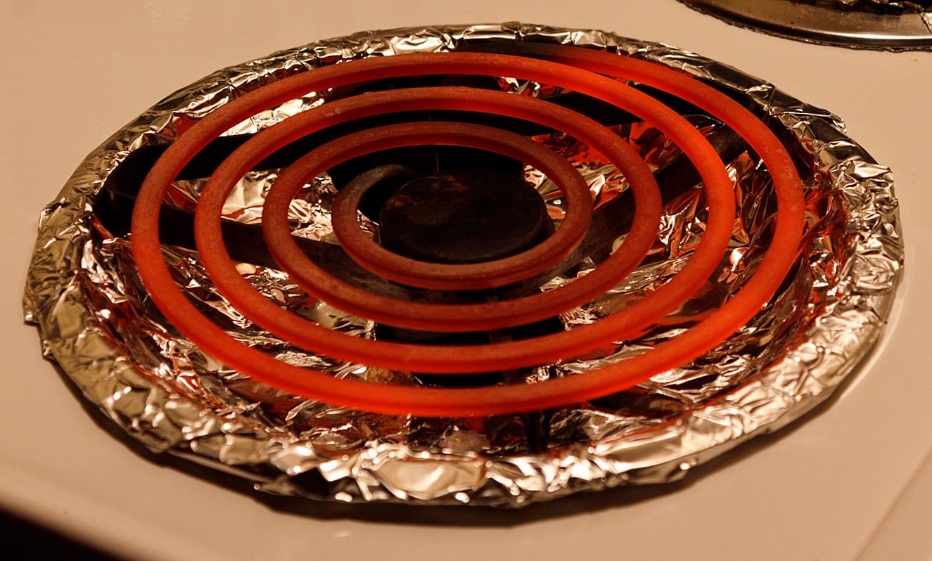 A glowing red-hot spiral resistance heating element coil