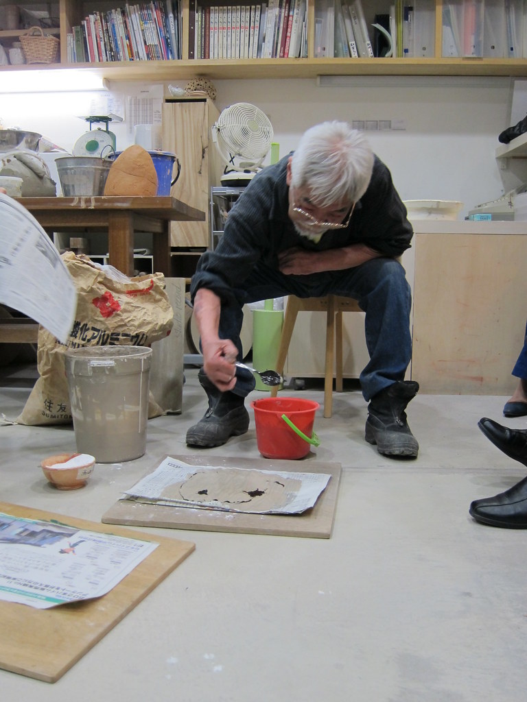 Ceramics workshop with multiple pottery wheels arranged for class use
